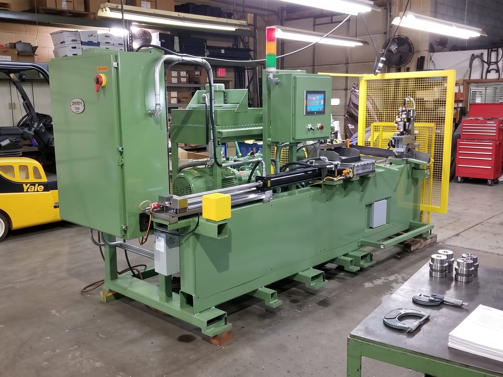Custom production machine built by Innovo Corporation on the shop floor in Elk Grove Village, IL — custom machines and dies built in the USA
